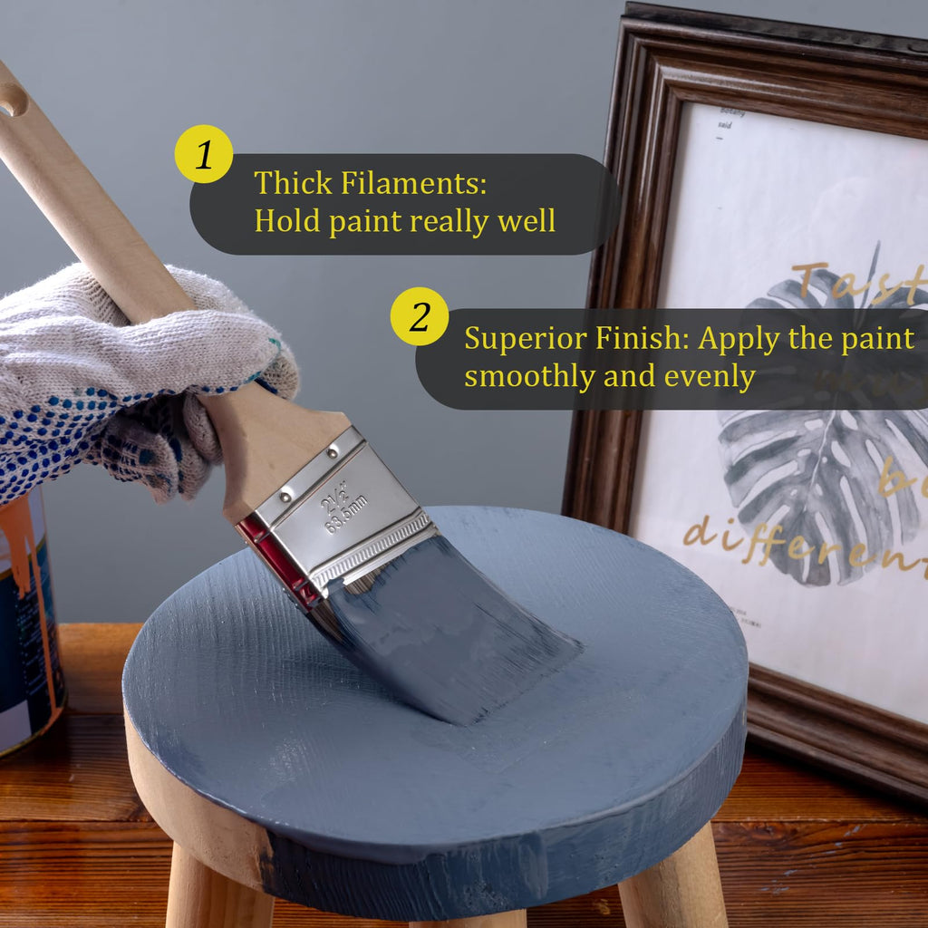 Mister Rui 2.5 Inch Angled Paint Brush Main-04 A 2.5" angled paintbrush dipped in paint is used to paint a small wooden stool. The thick filaments can absorb the paint well, making the paint even and smooth.