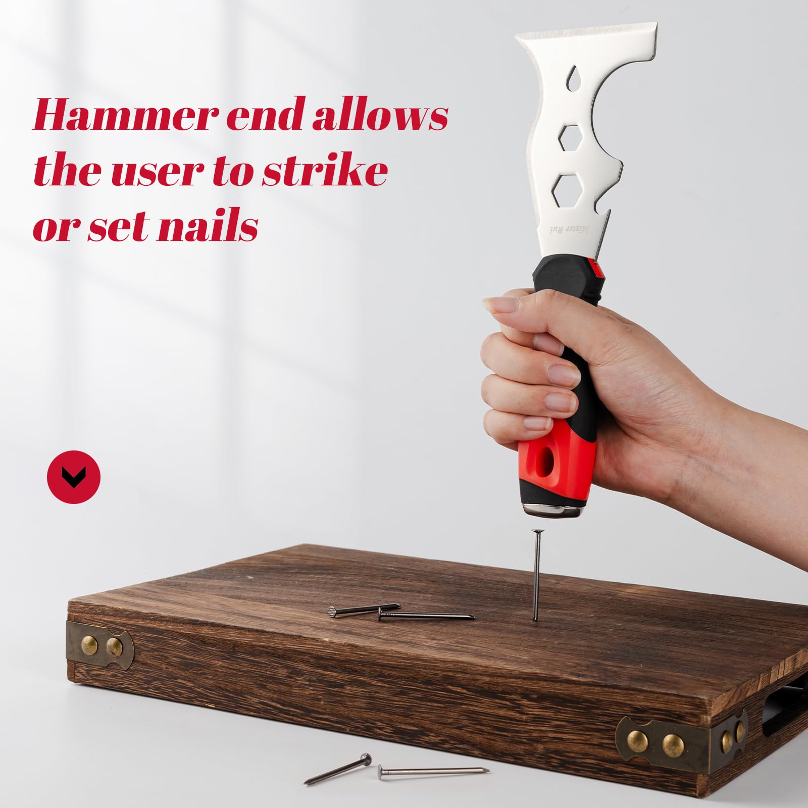 Mister Rui Multi Fuctional 13-in-1 Stainless Steel Putty Knife Main-09 Use the hammer end at the bottom of the handle to hammer the nail into the board